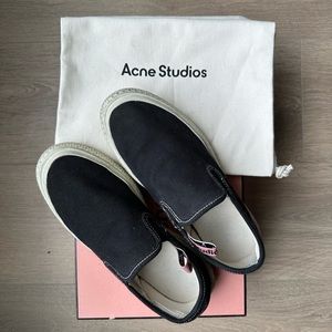 ACNE STUDIOS
Black Canvas Slip-On Sneakers